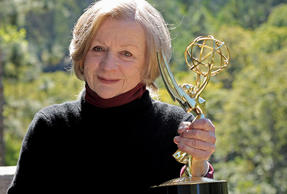 Molly Harris Campbell holding Emmy Award