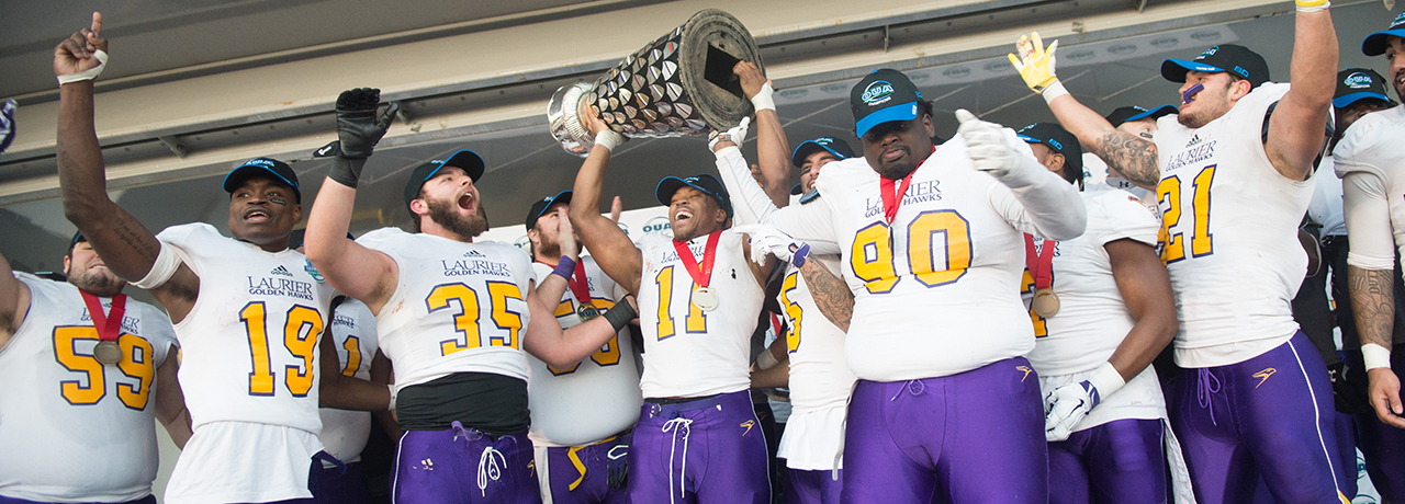 Laurier players celebrate their Yates Cup football victory.