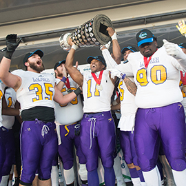 Laurier football players celebrate their Yates Cup victory.