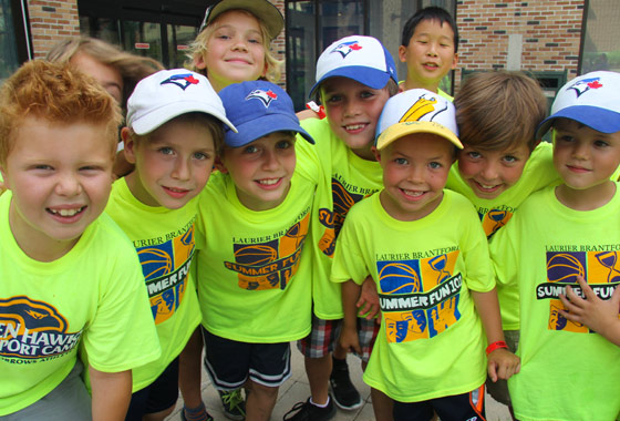 group of kids smiling at camera at a day camp in Brantford