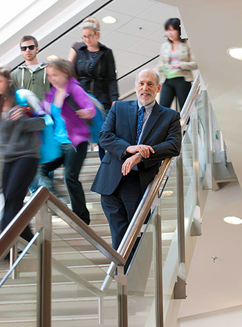 Dean Kelly of LSBE standing on stairs