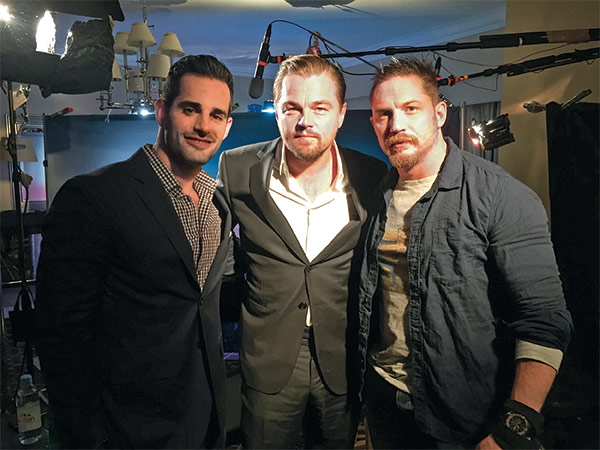 Chris Van Valet posing with Tom Hardy and Leonardo DiCaprio