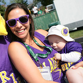 Laurier grad holding baby