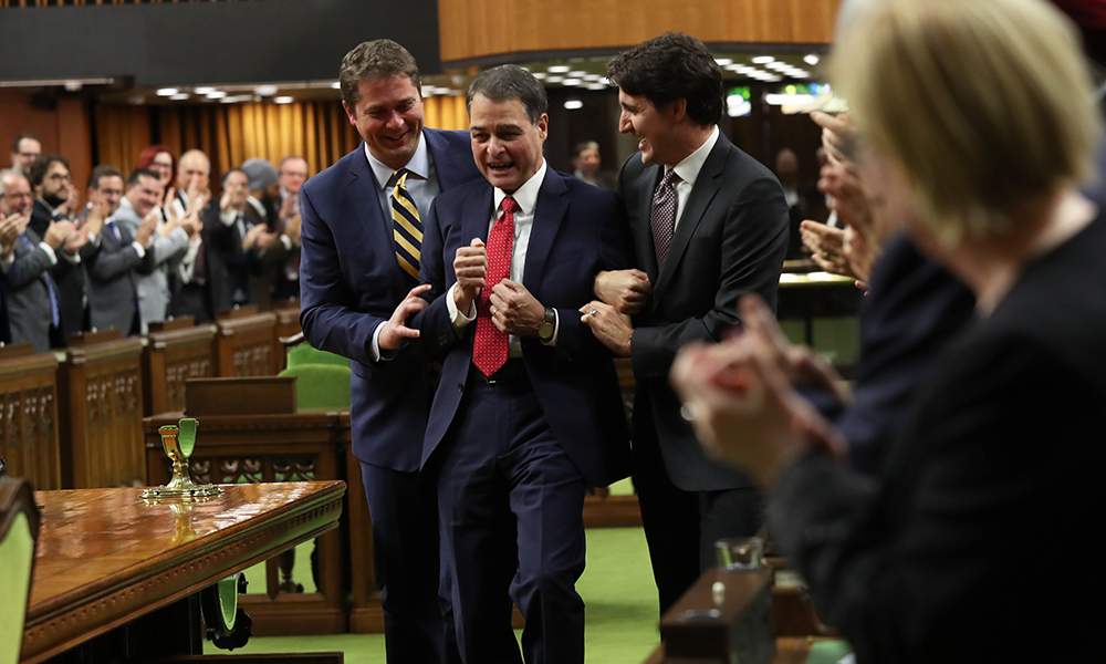 Speaker Anthony Rota being dragged to the Speaker's chair